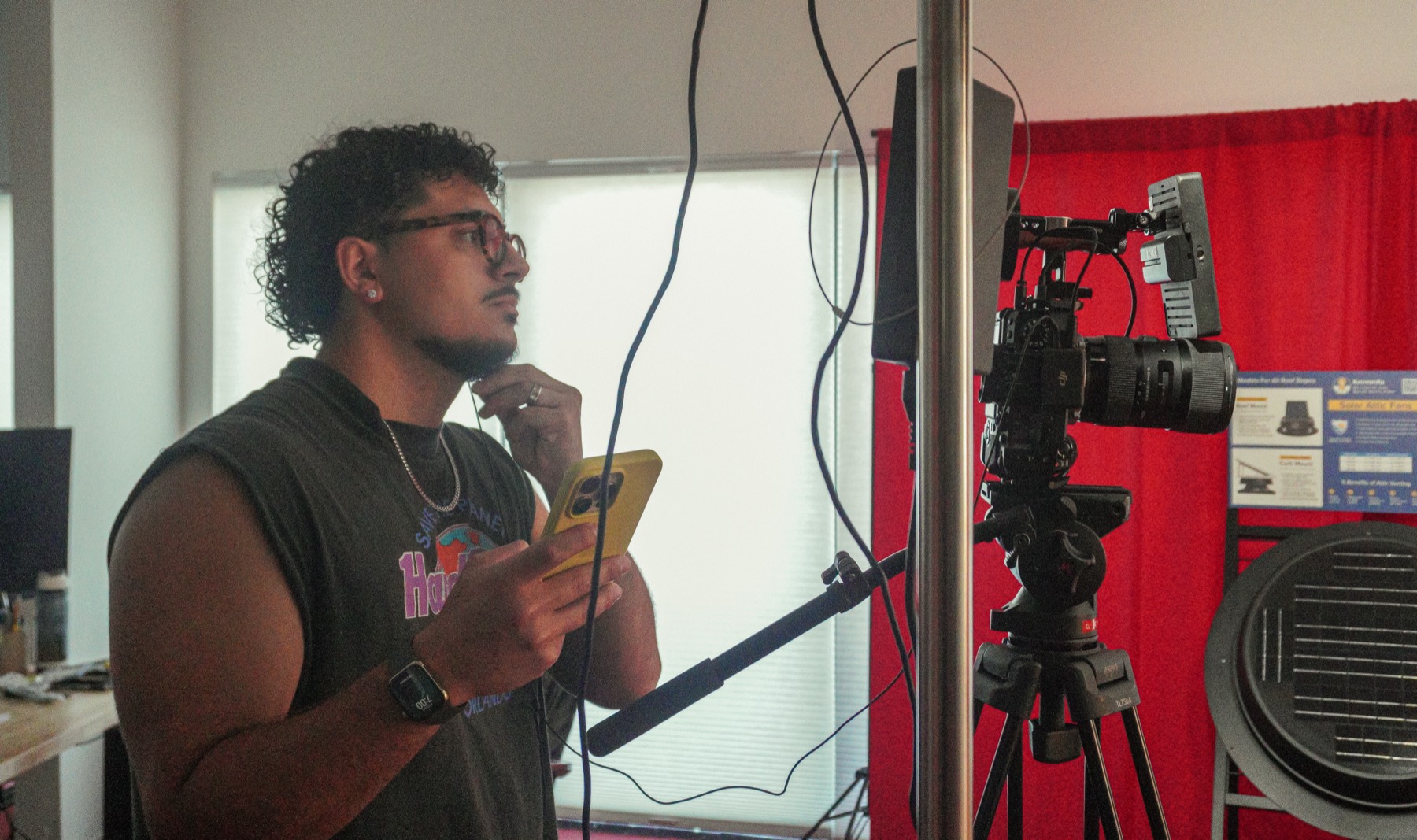 Ale Doria framing a shot behind the camera